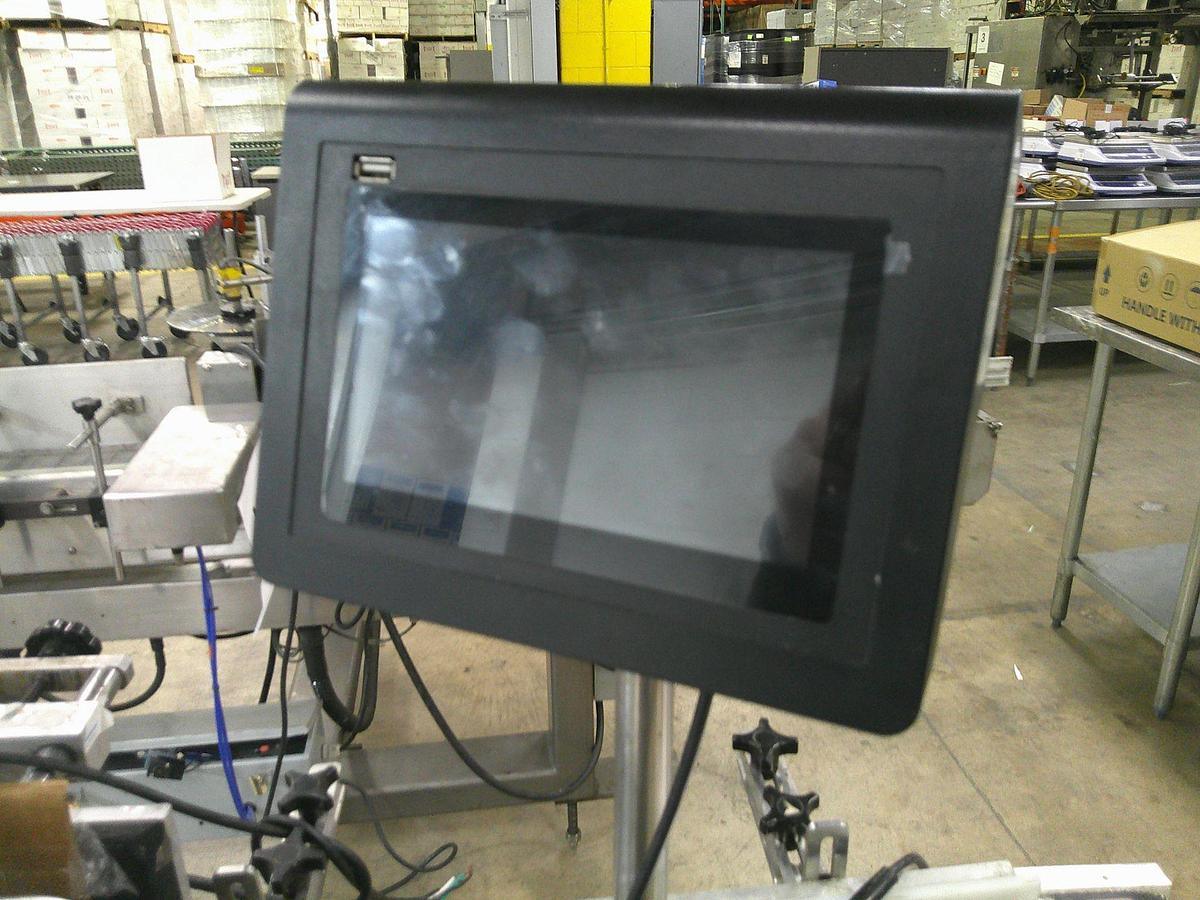 Used CVC 300 pressure sensitive wrap labeler