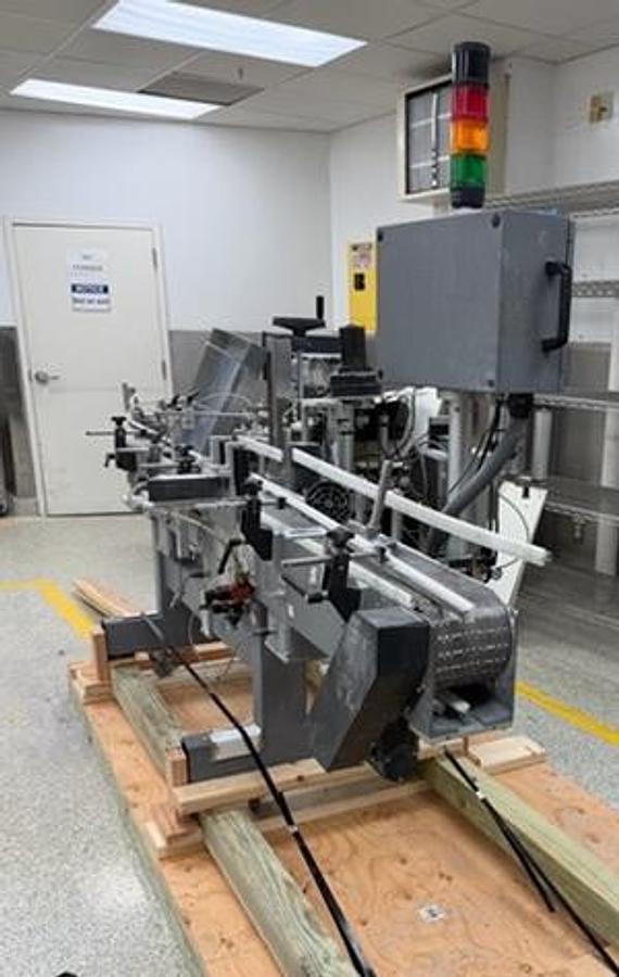 Used Universal 320 wrap labeler for larger containers 320