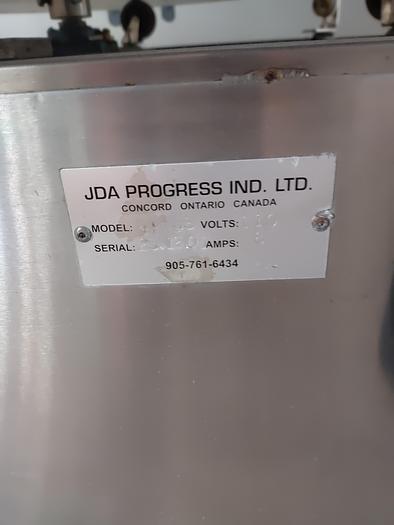Used JDA 6 head Gravity Filler with indexing conveyor SS m220.6