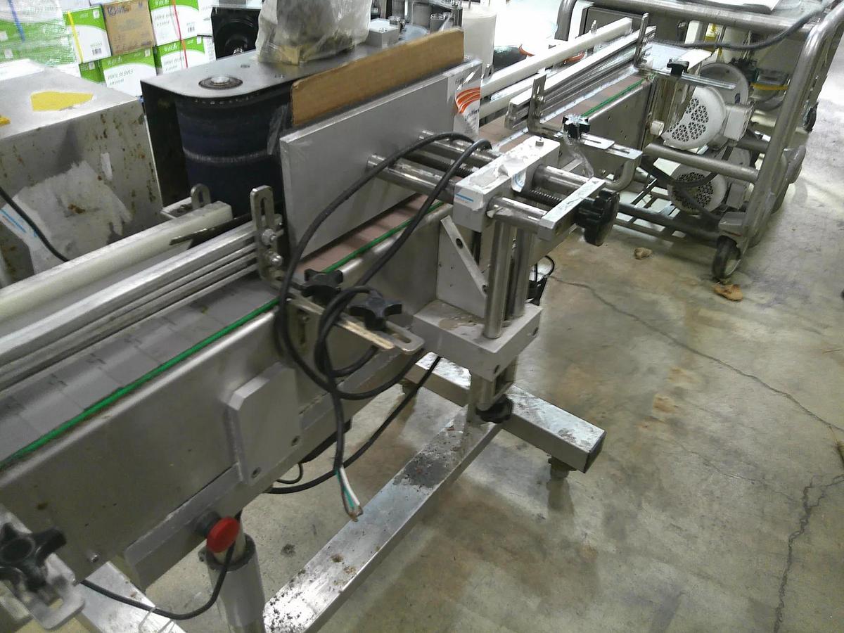 Used CVC 300 pressure sensitive wrap labeler