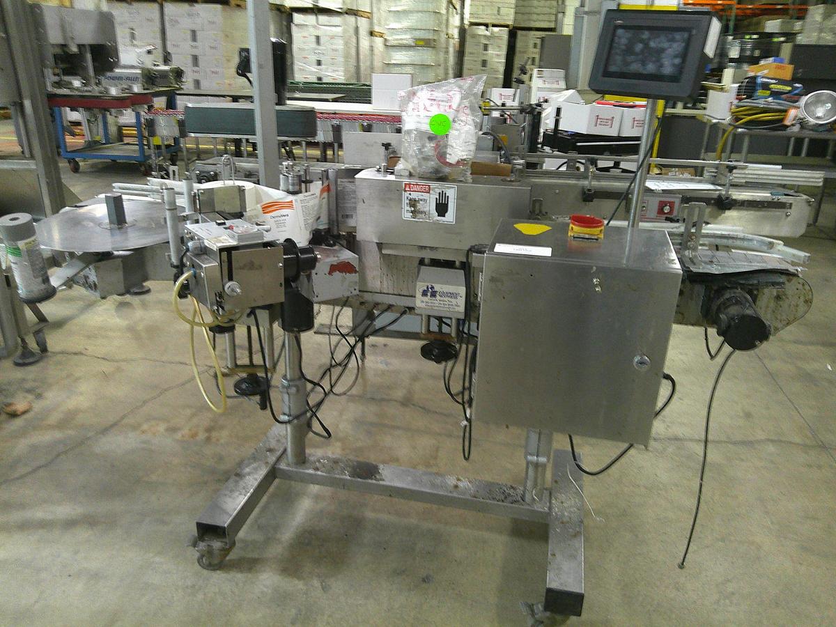 Used CVC 300 pressure sensitive wrap labeler