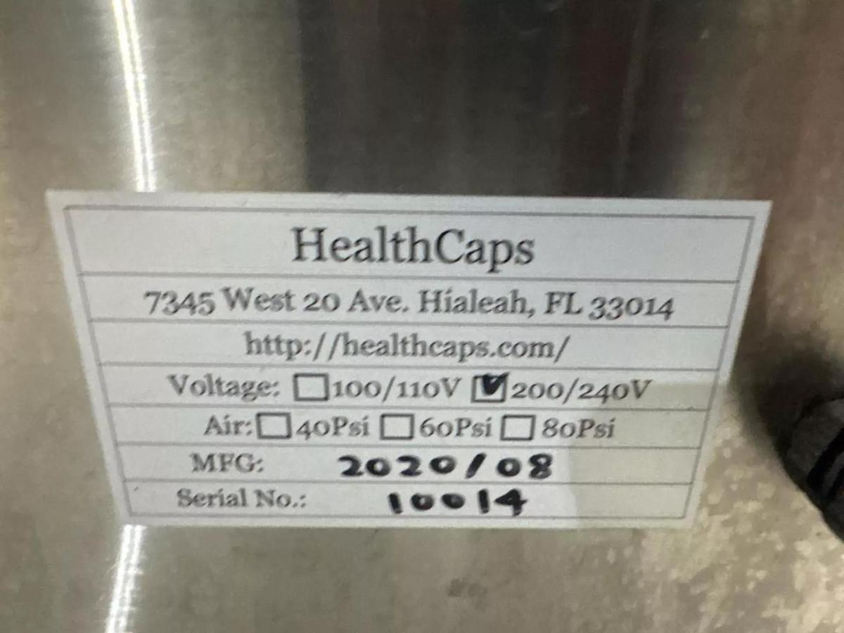 Used HealthCaps Automatic Pressure Sensitive Wraparound Labeler.