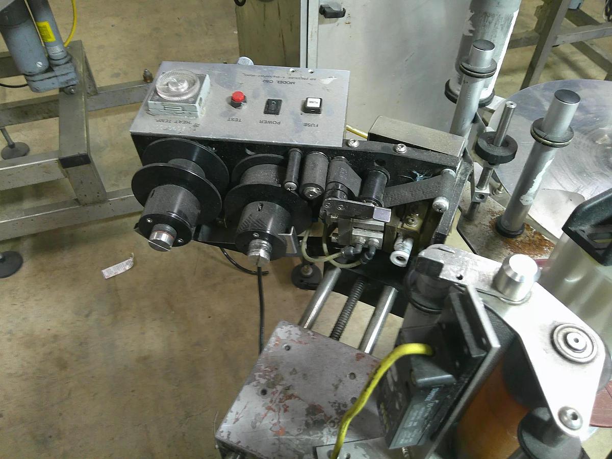 Used CVC pressure sensitive wrap labeler