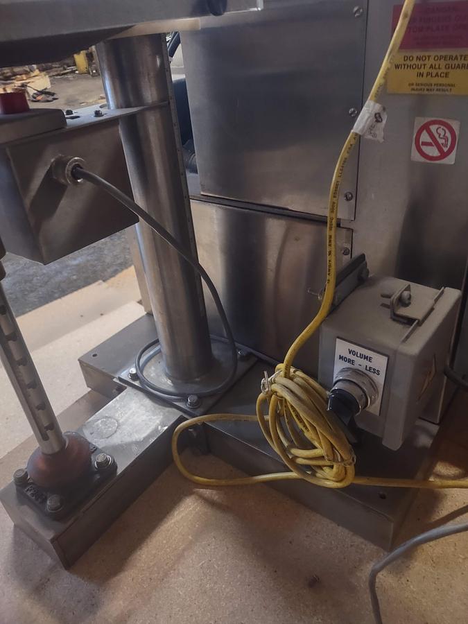 Used Speedee BR-234 Volumetric Filler with Foot pedal and eye operation.