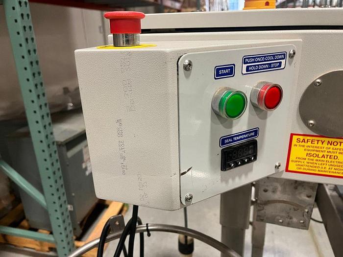 Used OK band sealer with conveyor on stainless stand