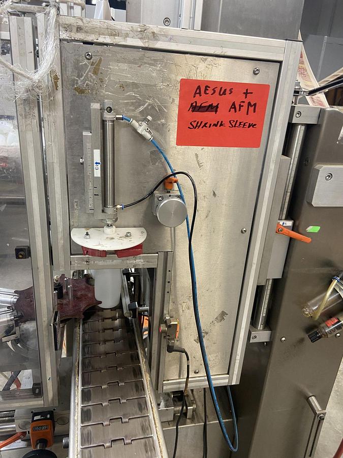 Used Aesus Eco Shrink Sleeve labeler with Steam Tunnel
