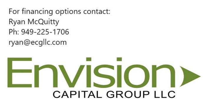 Used Quadrel E100 pressure sensitive wrap labeler for large bottles.