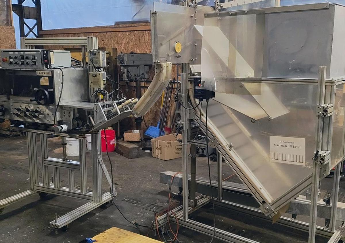 Used Equipment Express 6 quill capper with waterfall feeder