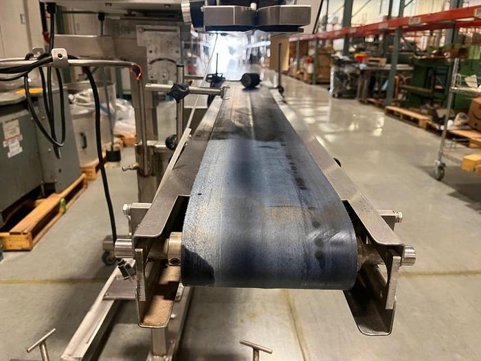 Used OK band sealer with conveyor on stainless stand