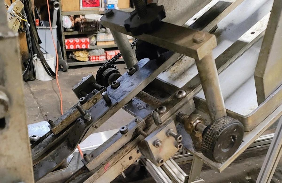 Used Equipment Express 6 quill capper with waterfall feeder