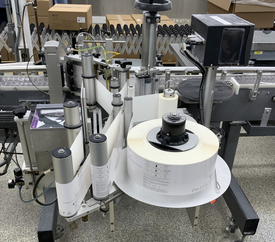 Used Universal 320 wrap labeler for larger containers 320