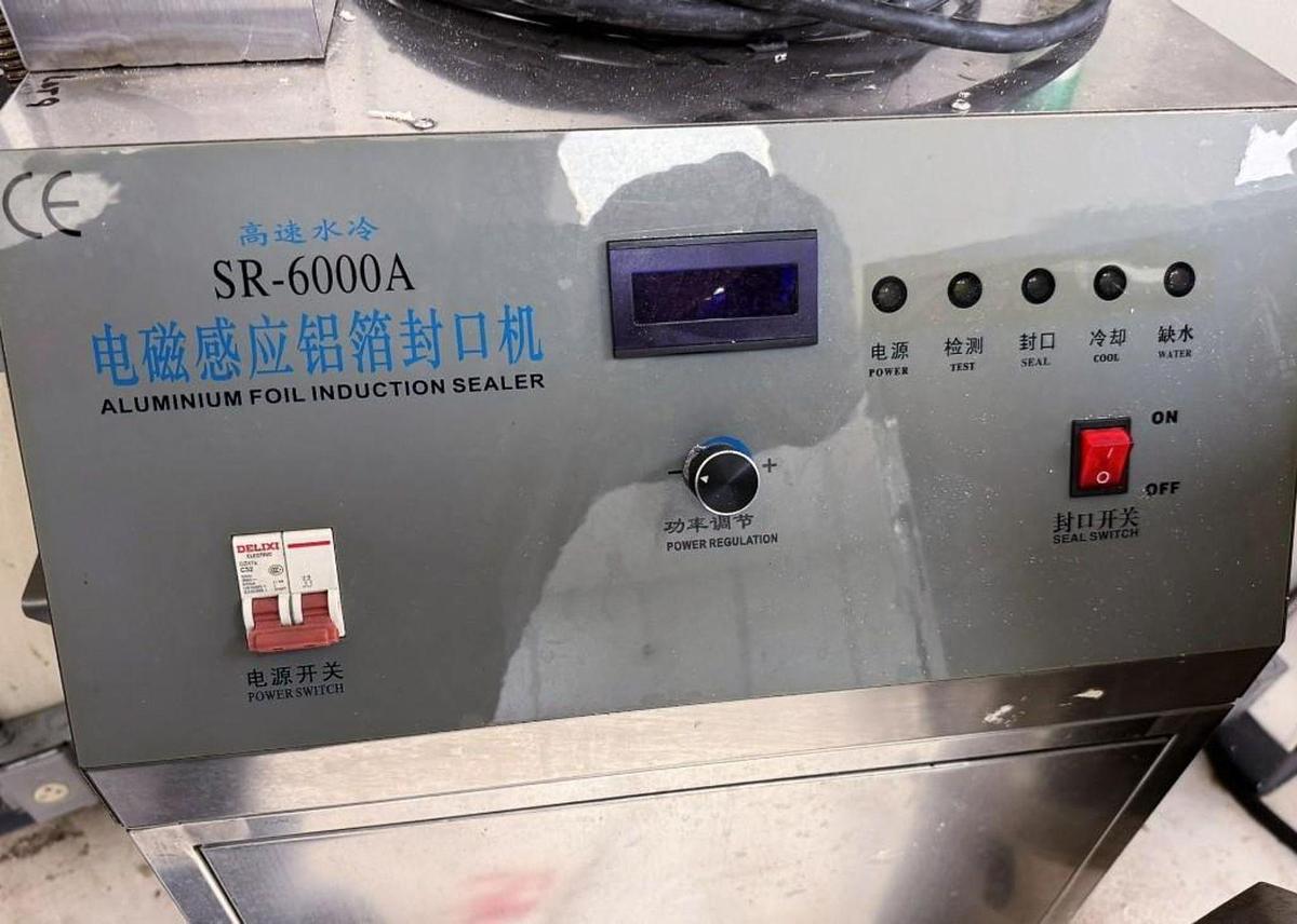Used Yiman Manufacturing Induction Sealer