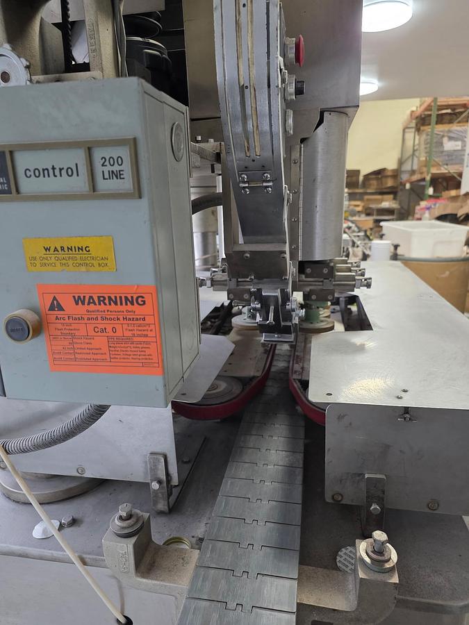 Used Resina U-30 Stainless steel base capper