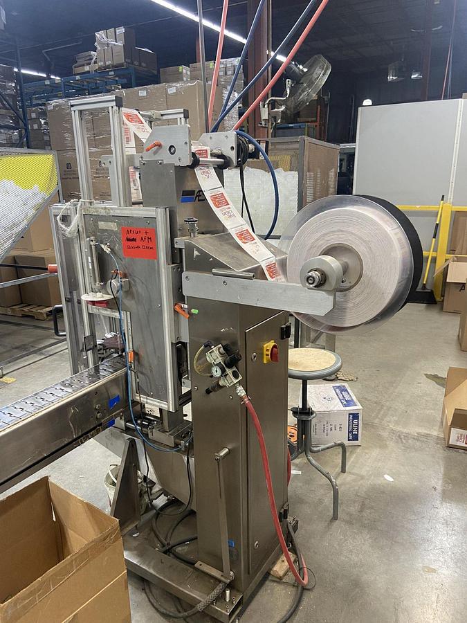 Used Aesus Eco Shrink Sleeve labeler with Steam Tunnel