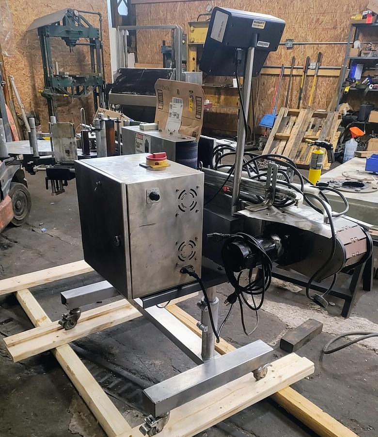 Used CVC  300 pressure sensitive wrap labeler