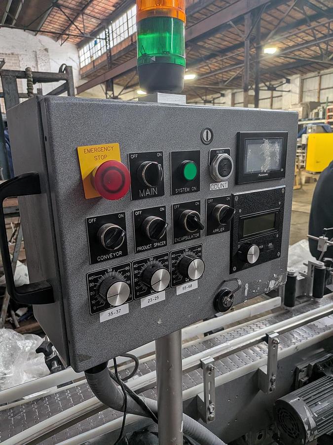 Used Universal 320 wrap labeler for larger containers 320