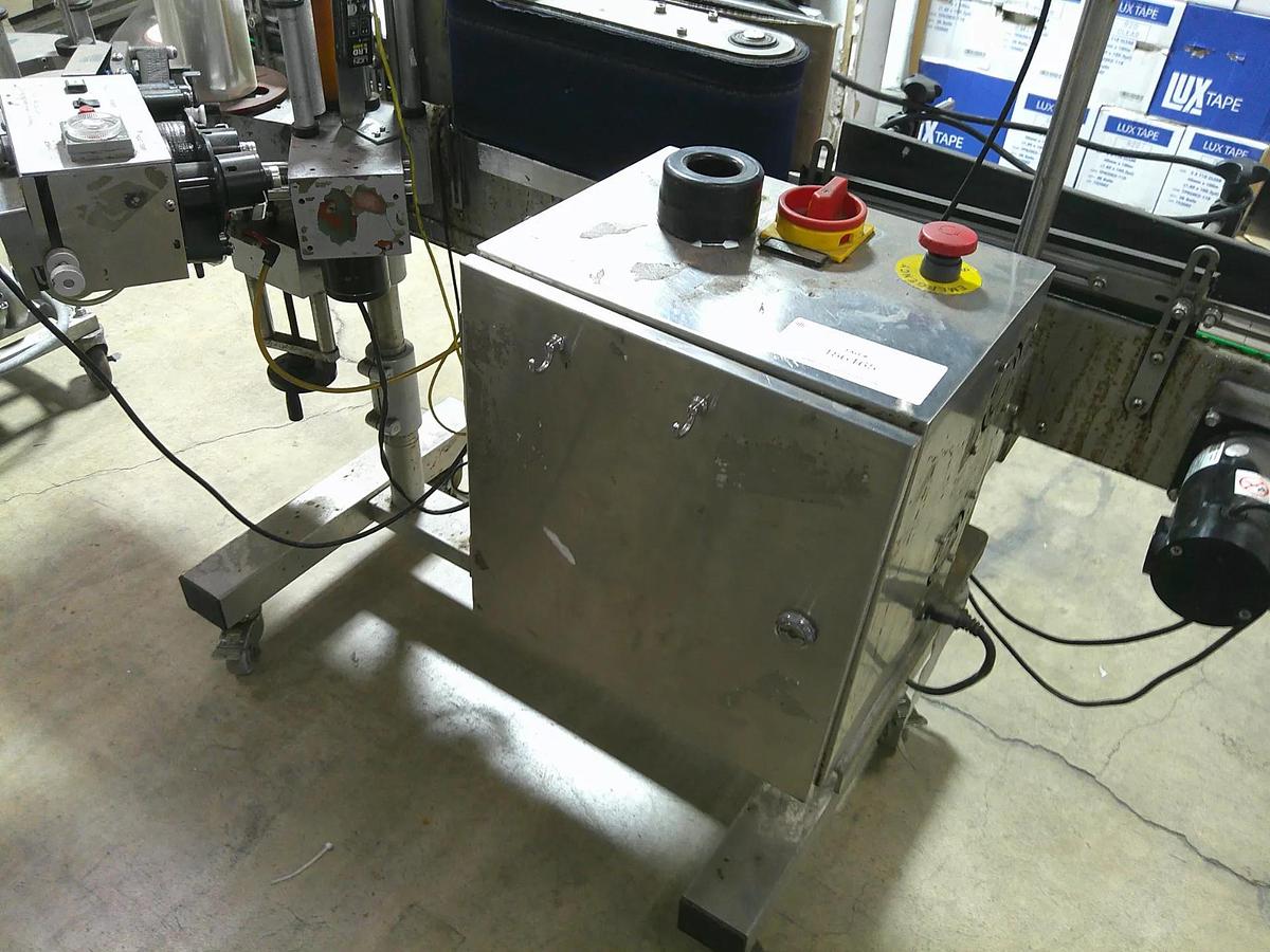 Used CVC pressure sensitive wrap labeler
