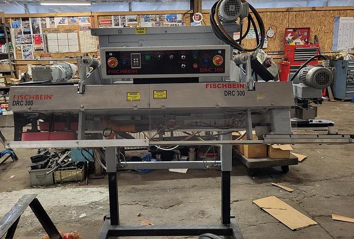 Used Fischbein DRC-300 dual roll close with hot melt