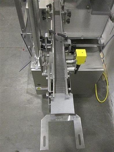 Used Genesis NPW-500 West Crimp Capper w/ Accum. Tables