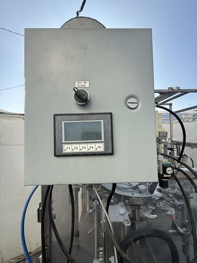 Used FILLER AND SEALER MACHINE