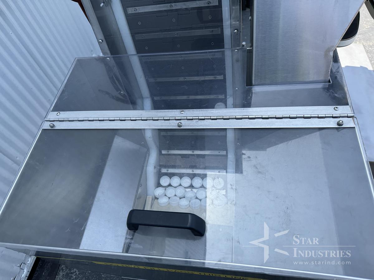 Used Six Spindle Capper with attached Cap Elevator
