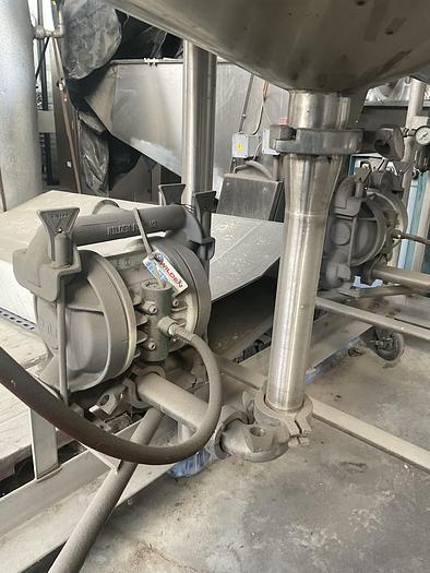 Used Twin 100 gallon S.S. Tanks w/ pumps on mezzanine