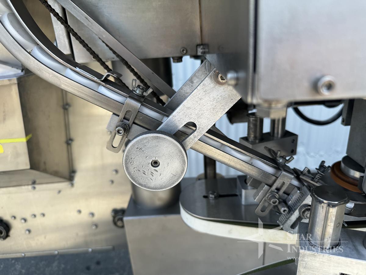 Used Six Spindle Capper with attached Cap Elevator