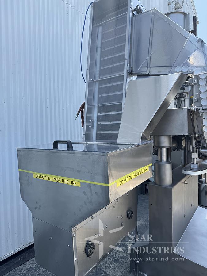 Used Six Spindle Capper with attached Cap Elevator