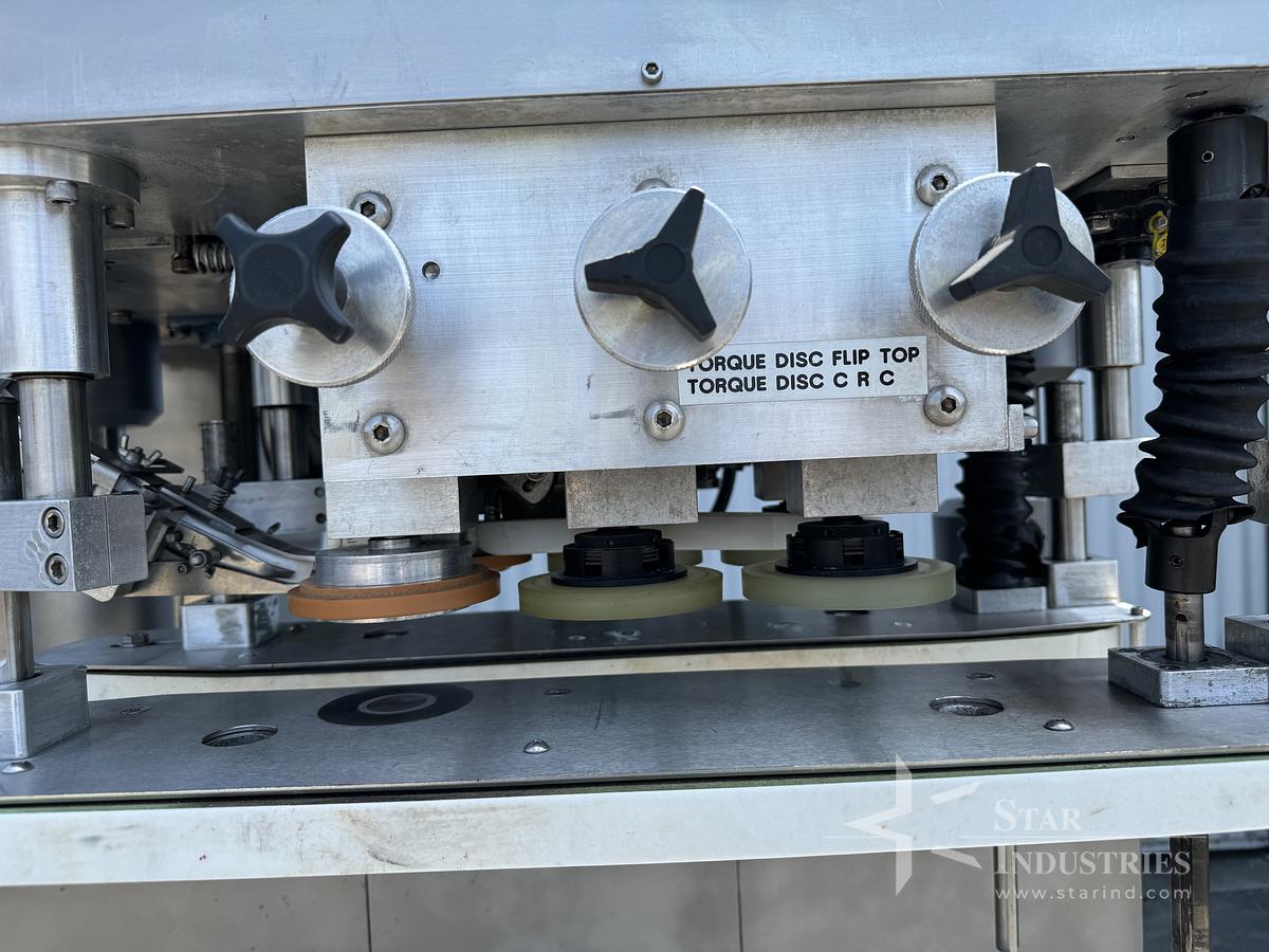 Used Six Spindle Capper with attached Cap Elevator