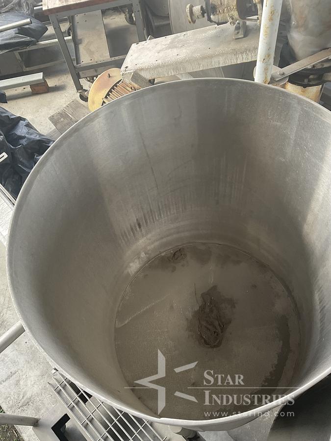 Used Twin 100 gallon S.S. Tanks w/ pumps on mezzanine