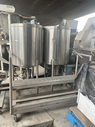 Used Twin 100 gallon S.S. Tanks w/ pumps on mezzanine