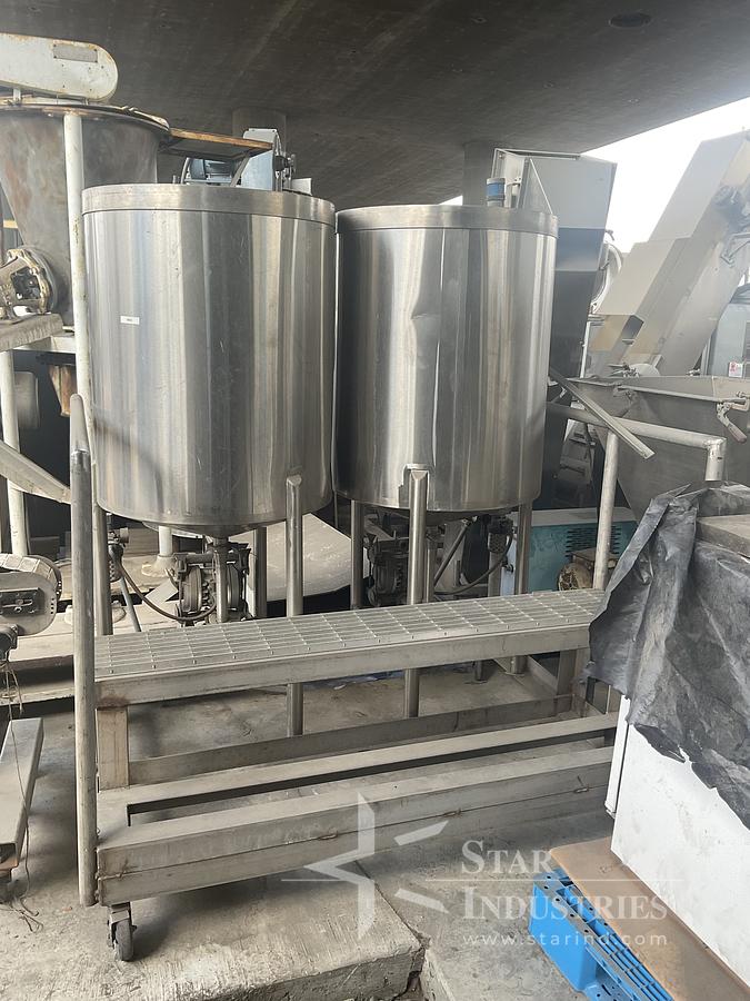 Used Twin 100 gallon S.S. Tanks w/ pumps on mezzanine