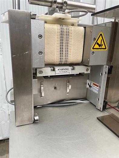 Used Azco Vertical Pouch Dispenser