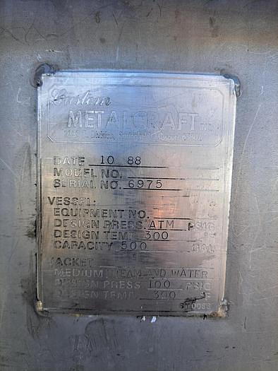Used Tank, 500-Gallon, Stainless Steel, Scrape Agitation, JacketedMetal Craft 500-gallon stainless steel full jacketed and scrape agitated tank, constructed of 304 stainless steel. Measures 56" diameter x 58" straight side with flat top and dish bottom. Set up for side and bottom scrapers. Driven by a top-mounted drive through a gear reducer. 7.5 HP motor, 1755 RPM, 230/460V, 3/60Hz, with a gear reducer output of 40 RPM. Vessel is mounted on 4 stainless steel legs and features a 3" diameter center bottom outlet. Jacket Design pressure: 100 PSI, design temperature: 300°F. Last used in cosmetics industry.