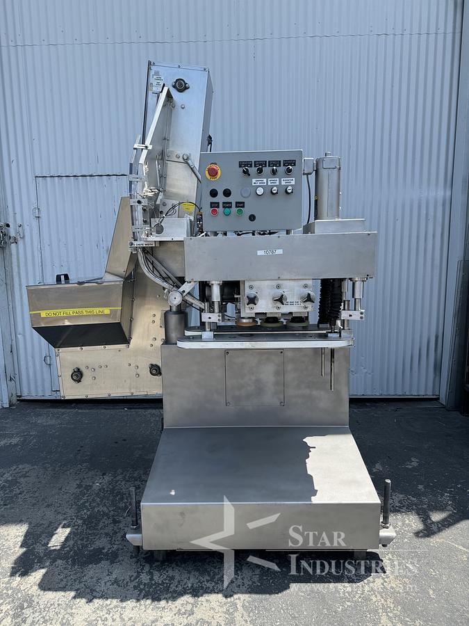 Used Six Spindle Capper with attached Cap Elevator