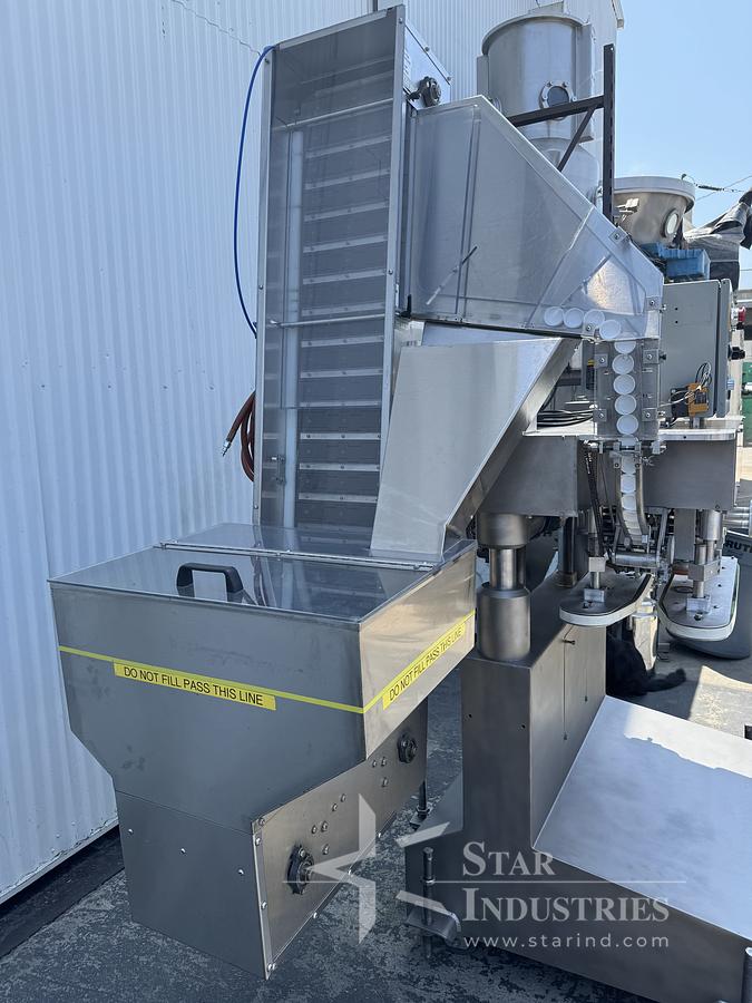 Used Six Spindle Capper with attached Cap Elevator