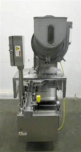 Used Genesis NPW-500 West Crimp Capper w/ Accum. Tables