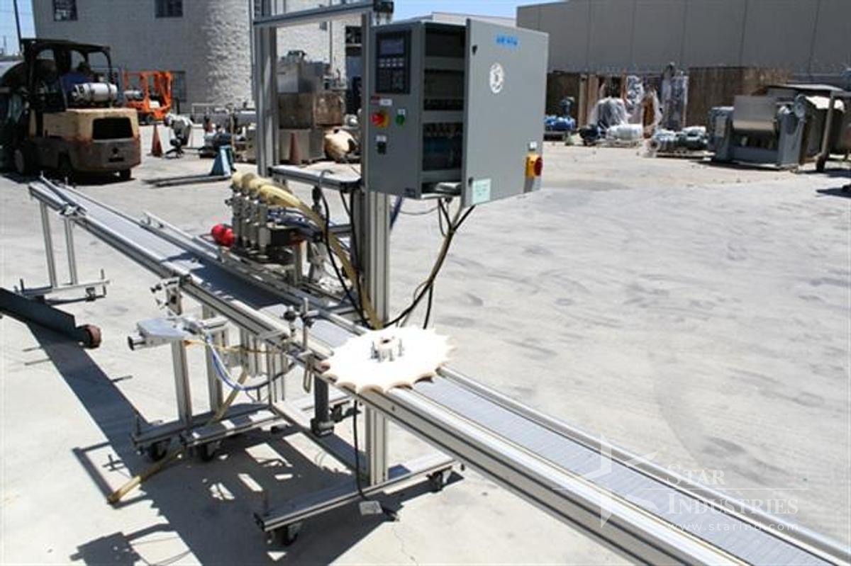 Used Equipment Express In-line 4-head time/pressure Filler