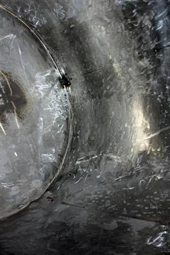 Used 500 gallon S.S. Tank, w/ hinged covers, side discharge, on legs