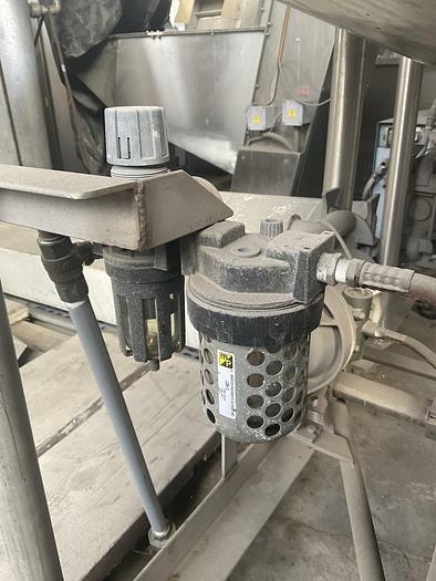 Used Twin 100 gallon S.S. Tanks w/ pumps on mezzanine