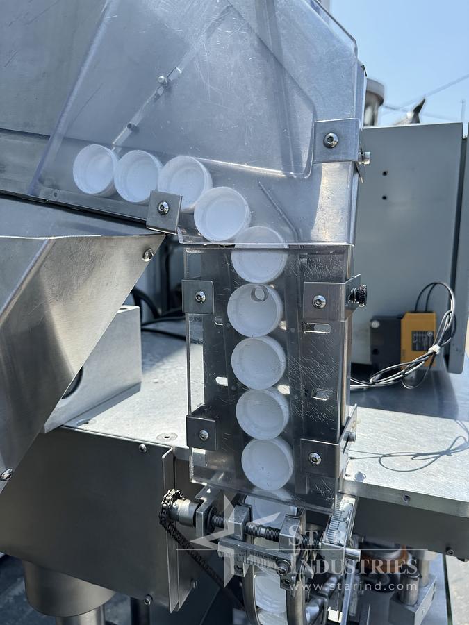 Used Six Spindle Capper with attached Cap Elevator