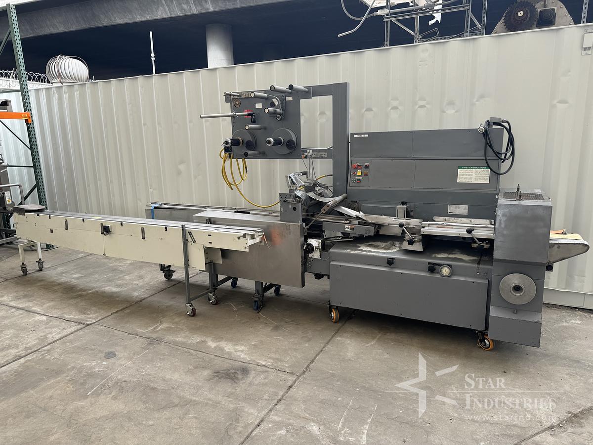 Used FMC Model WA-520 Flow-Wrapper w/ Conveyor