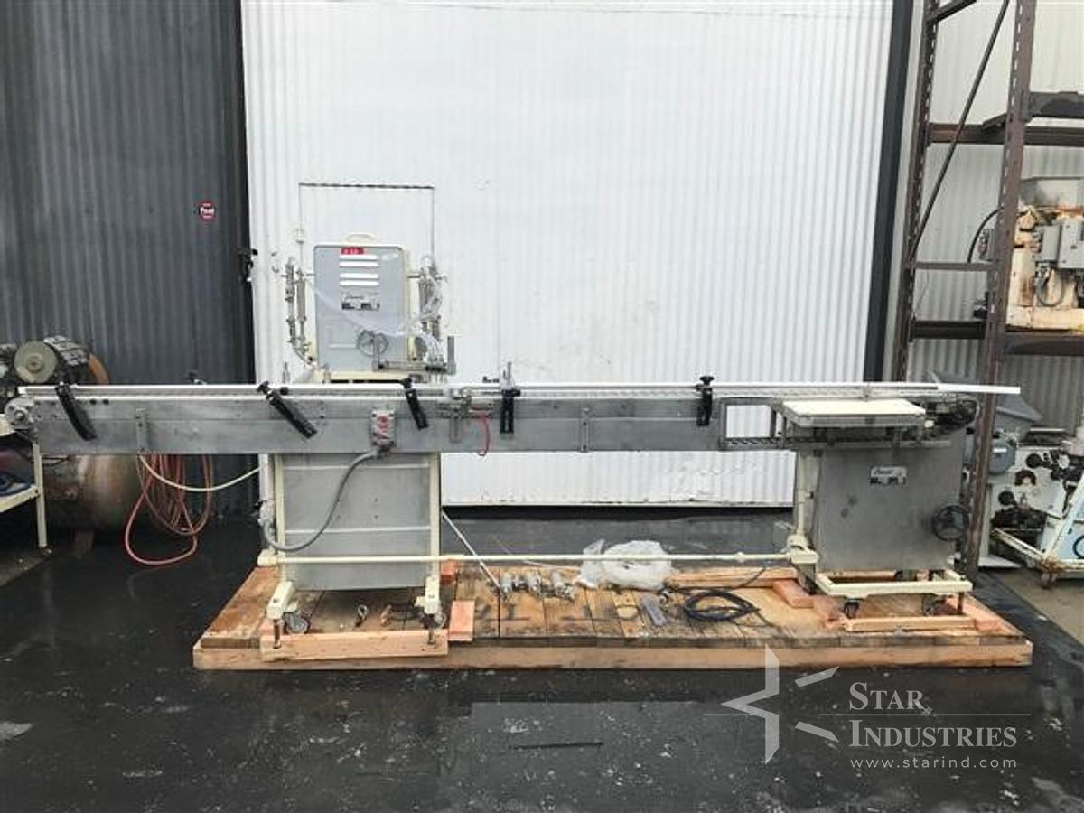 Used Filamatic Four Head Piston Filler With Conveyor
