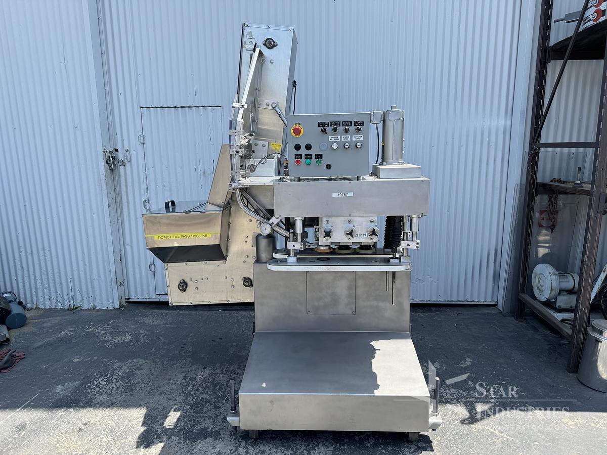Used Six Spindle Capper with attached Cap Elevator