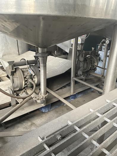 Used Twin 100 gallon S.S. Tanks w/ pumps on mezzanine