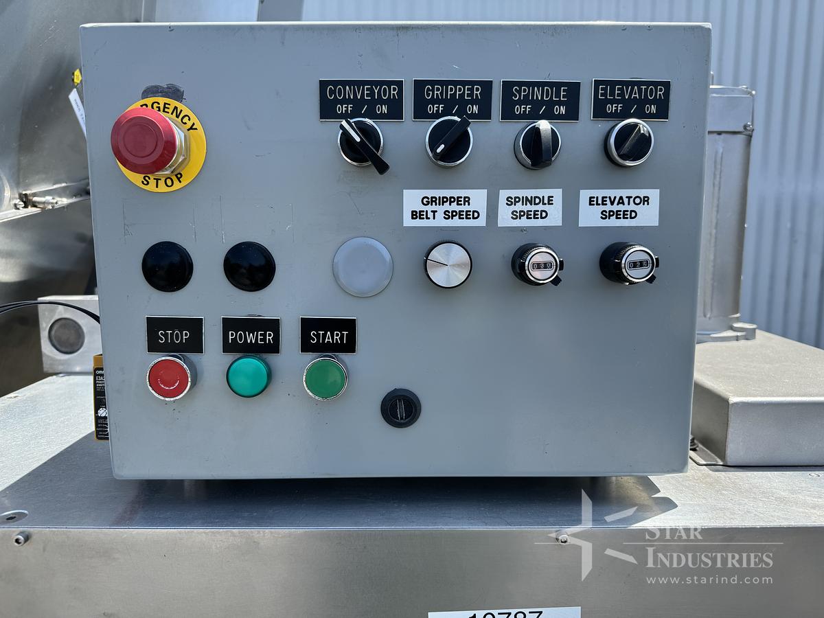 Used Six Spindle Capper with attached Cap Elevator