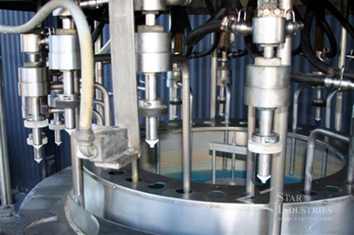 Used U.S. Rotary Gravity Filler, 18 heads for gallons