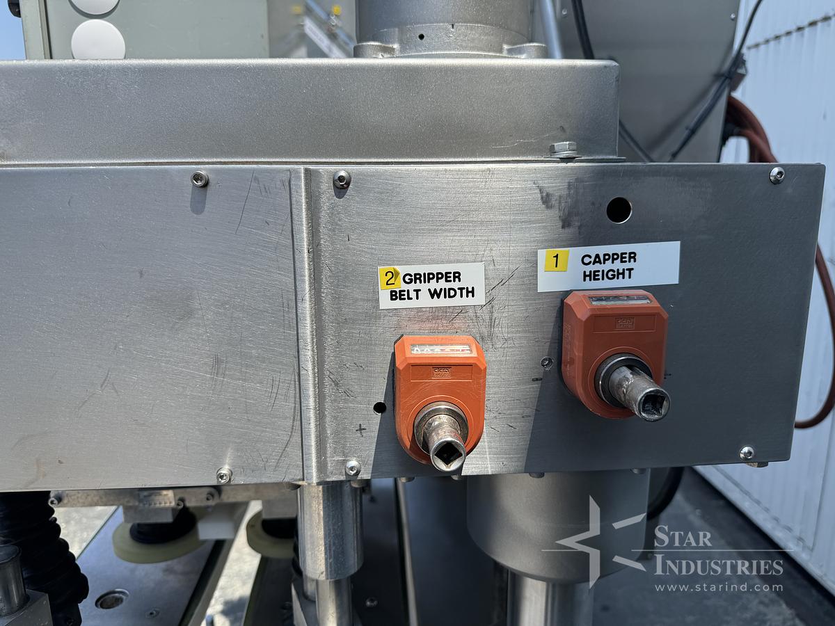 Used Six Spindle Capper with attached Cap Elevator