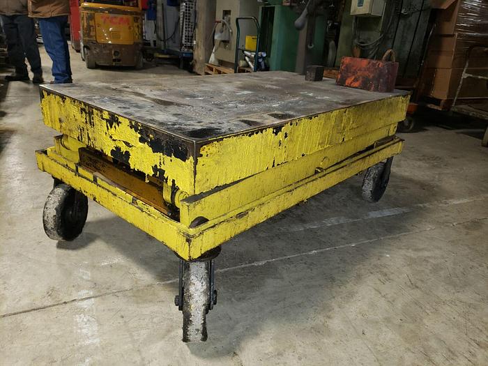 Used Large Yellow 6000# Scissor Lift on 4 Castors, 64” x 36” Platform