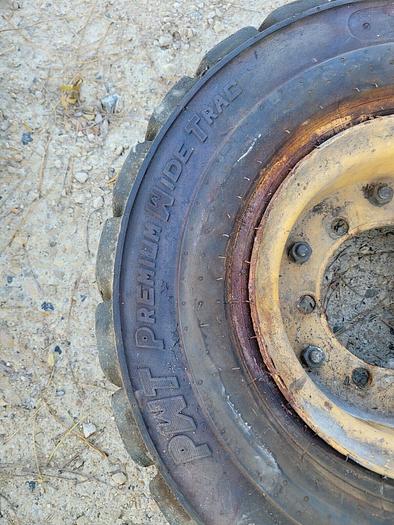 Used Titan 6.50-10 NHS PWT Premium Wide Trac Pneumatic Equipment Tire w/6 Bolt Rim